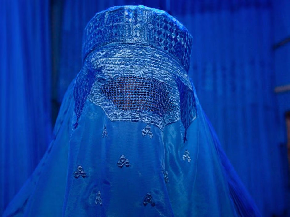one-of-garfors-friends-whom-he-was-traveling-with-took-this-photo-of-garfors-trying-on-a-burqa-in-afghanistan-the-photo-later-a